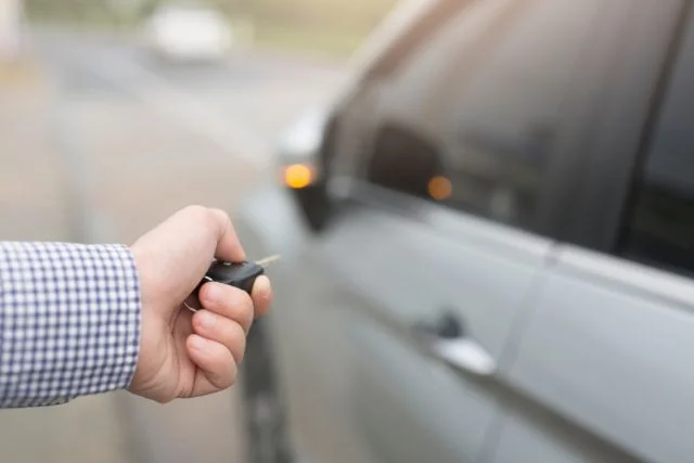 Opening a car using a transponder key.